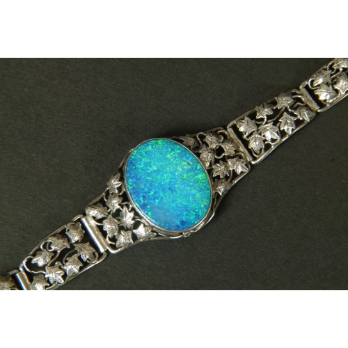 317 - AN OPAL DOUBLET BRACELET IN SILVER BY RHODA WAGER c. 1930 the oval cabochon stone collet set to the ... 