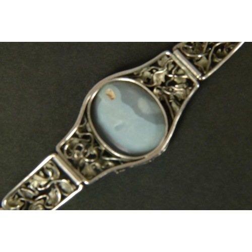 317 - AN OPAL DOUBLET BRACELET IN SILVER BY RHODA WAGER c. 1930 the oval cabochon stone collet set to the ... 