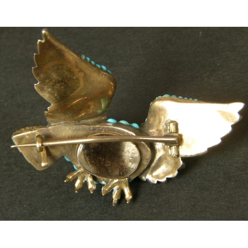 333 - A 19TH CENTURY TURQUOISE SET EAGLE BROOCH in silver with gold facings, back and fittings, engraved g... 