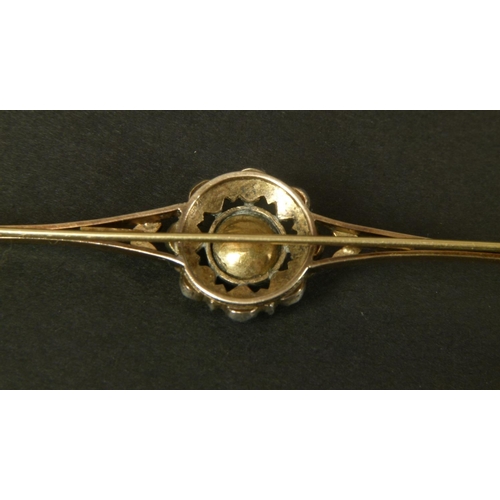 338 - A DIAMOND BAR BROOCH, set to the centre with a foil backed rose cut stone in a cut down setting with... 