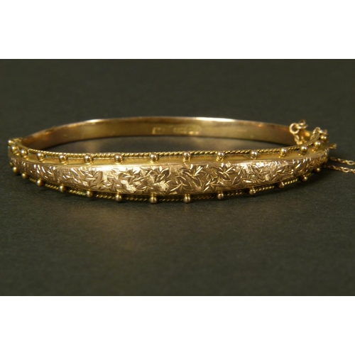 361 - A VICTORIAN STIFF HINGED BANGLE in 9ct rose gold by Peyton Pepper Ltd, Birmingham 1898, tapered and ... 