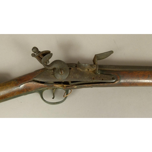 37 - A LATE 18TH CENTURY FLINTLOCK MUSKET  three quarter stocked with steel lock plate engraved REA, bras... 