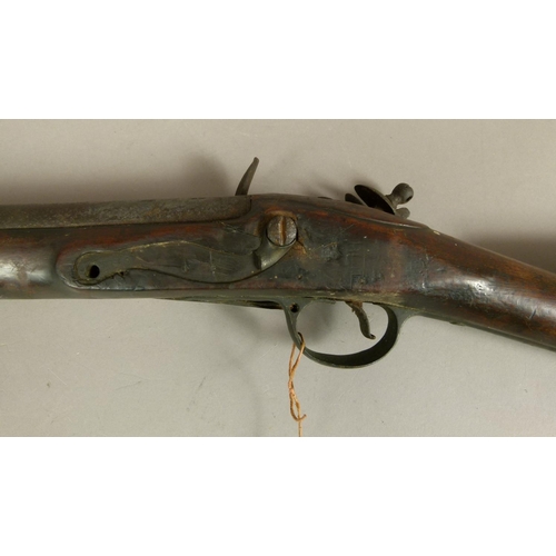 37 - A LATE 18TH CENTURY FLINTLOCK MUSKET  three quarter stocked with steel lock plate engraved REA, bras... 