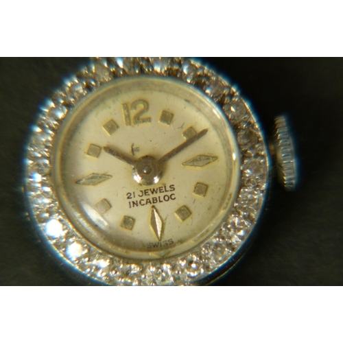 372 - A LADY'S DIAMOND SET WRISTWATCH IN 18CT WHITE GOLD, c.1958 , Swiss jewelled lever movement by Felsa,... 