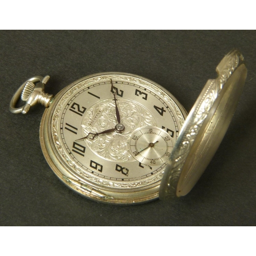 374 - ART DECO POCKET WATCH BY TRAVANNES in an open faced 14ct gold case No 992314 with foliate scroll eng... 