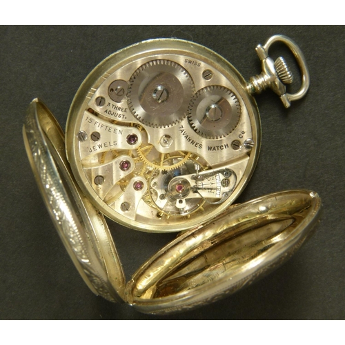 374 - ART DECO POCKET WATCH BY TRAVANNES in an open faced 14ct gold case No 992314 with foliate scroll eng... 