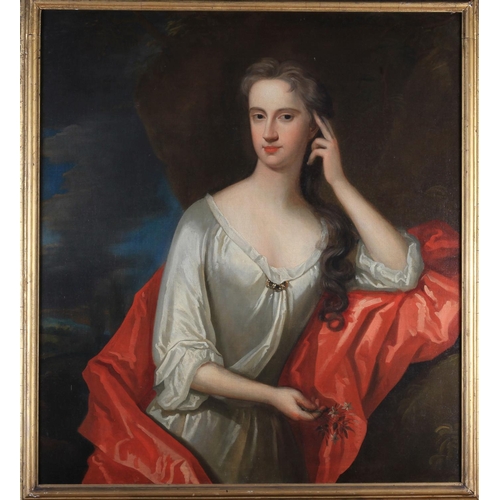 385 - CIRCLE OF SIR GODFREY KNELLER (1646-1723) Portrait of a lady, wearing a white dress with a red cloak... 