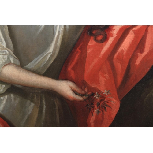 385 - CIRCLE OF SIR GODFREY KNELLER (1646-1723) Portrait of a lady, wearing a white dress with a red cloak... 