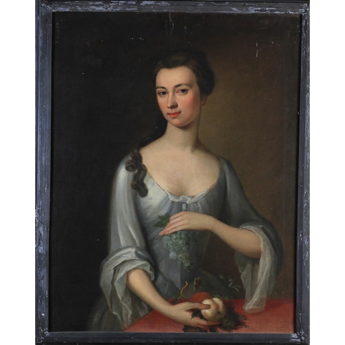 388 - ATTRIBUTED TO MARIA VERELST (1680-1744) Portrait of a lady, half-length, in a silver white gown, hol... 