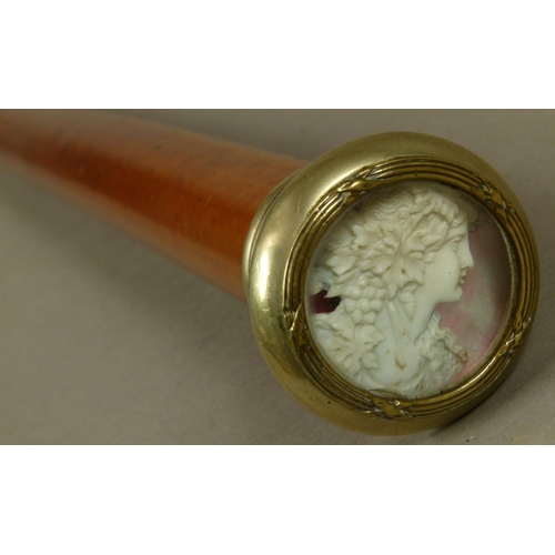 42 - A SLIGHTLY TAPERED BAMBOO WALKING STICK the pommel silver plated with clasped reeded border, glazed ... 