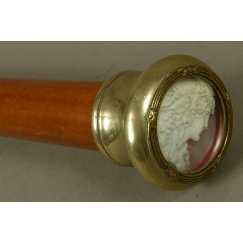 42 - A SLIGHTLY TAPERED BAMBOO WALKING STICK the pommel silver plated with clasped reeded border, glazed ... 