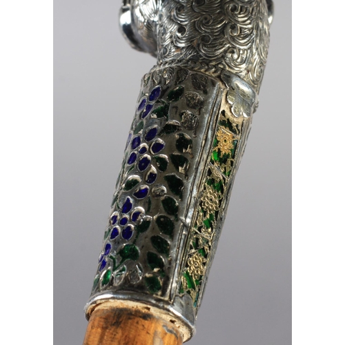 43 - A 19TH CENTURY SILVER COLOURED METAL, ENAMEL AND GLASS WALKING STICK terminal cast as a lion's head ... 