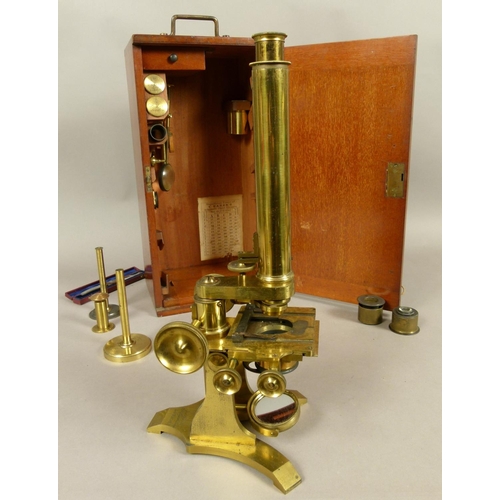 48 - A 19TH CENTURY BRASS MICROSCOPE BY C. BAKER OF LONDON, complete with lenses, magnifier and drawer of... 