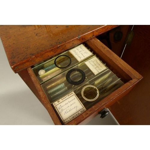 48 - A 19TH CENTURY BRASS MICROSCOPE BY C. BAKER OF LONDON, complete with lenses, magnifier and drawer of... 