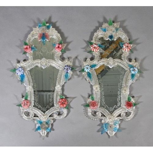 480 - A PAIR OF VENETIAN WALL MIRRORS of arched and waisted outline, the top plate etched with leaf scroll... 