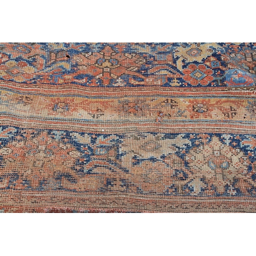 488 - A SURYVNA CARPET, West Anatolia the terracotta field with overall bold palmettes and lozenges within... 