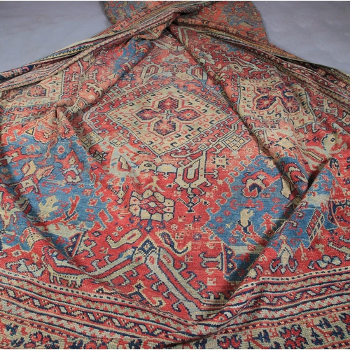 489 - A SURYVNA CARPET, West Anatolia the blue field with overall palmettes, vines and leaves within a con... 