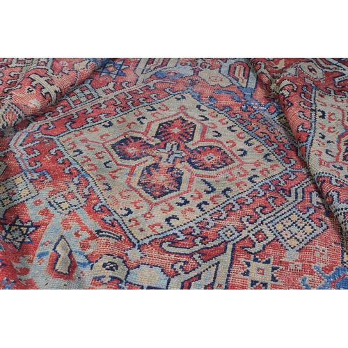 489 - A SURYVNA CARPET, West Anatolia the blue field with overall palmettes, vines and leaves within a con... 