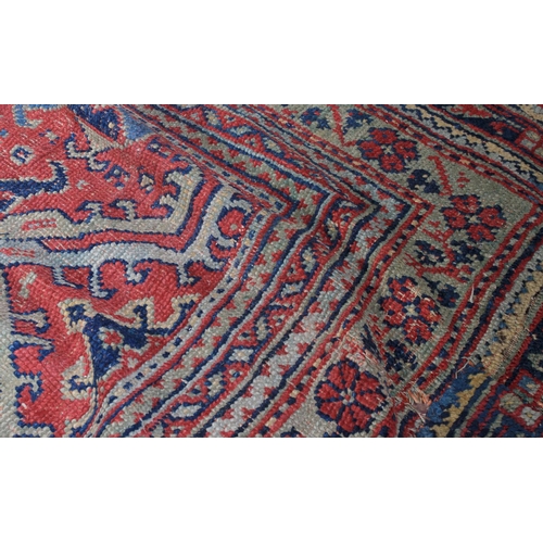 489 - A SURYVNA CARPET, West Anatolia the blue field with overall palmettes, vines and leaves within a con... 