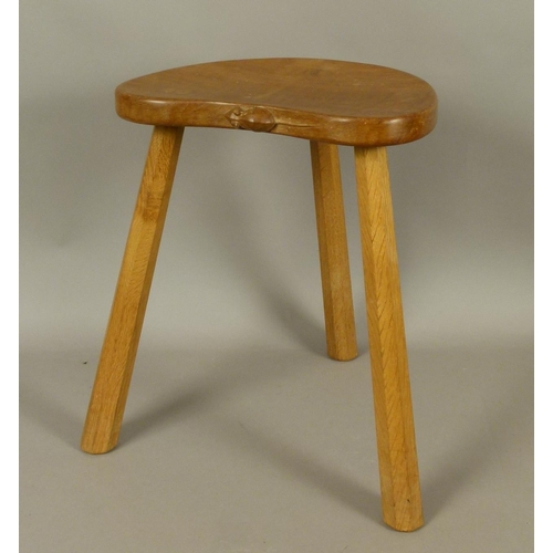 500 - A THOMPSON OF KILBURN 'MOUSEMAN' OAK STOOL on three octagonal tapered legs, carved in relief with a ... 