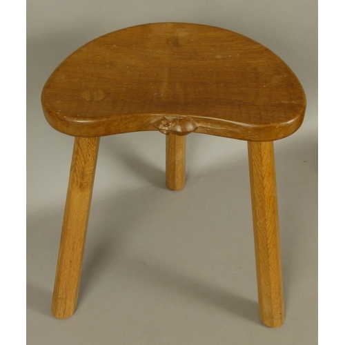 500 - A THOMPSON OF KILBURN 'MOUSEMAN' OAK STOOL on three octagonal tapered legs, carved in relief with a ... 