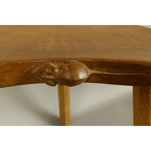 500 - A THOMPSON OF KILBURN 'MOUSEMAN' OAK STOOL on three octagonal tapered legs, carved in relief with a ... 