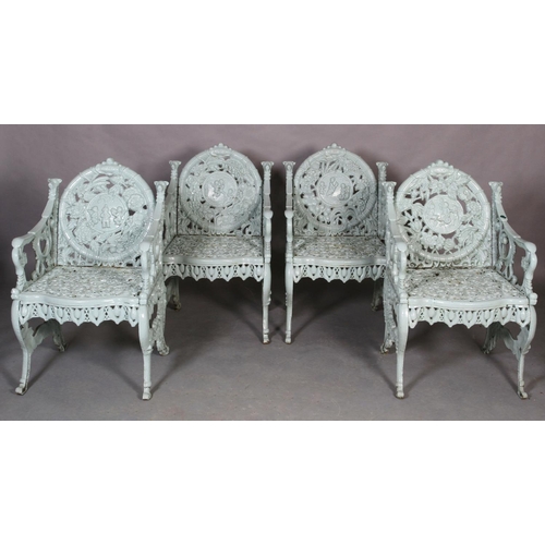 505 - A SET OF FOUR CAST IRON 'SEASONS' CHAIRS, each back with a roundel of infants, an amorini within flo... 