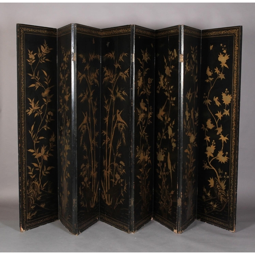 506 - A CHINESE EIGHT FOLD BLACK LACQUER AND GILT DECORATED SCREEN, the central continuous panel with land... 