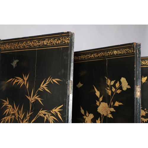 506 - A CHINESE EIGHT FOLD BLACK LACQUER AND GILT DECORATED SCREEN, the central continuous panel with land... 