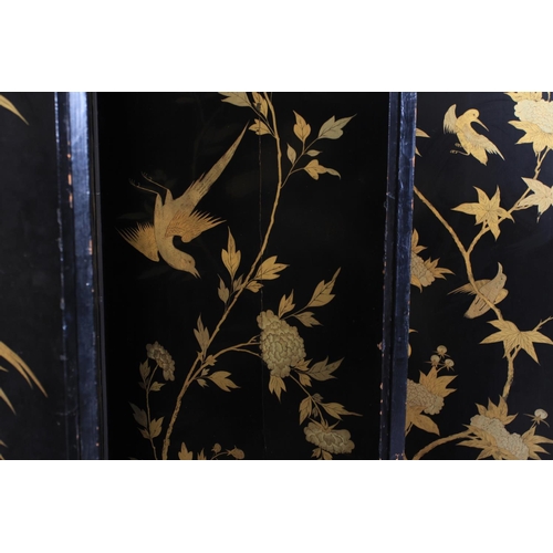 506 - A CHINESE EIGHT FOLD BLACK LACQUER AND GILT DECORATED SCREEN, the central continuous panel with land... 