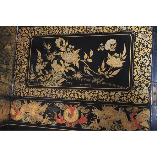 506 - A CHINESE EIGHT FOLD BLACK LACQUER AND GILT DECORATED SCREEN, the central continuous panel with land... 