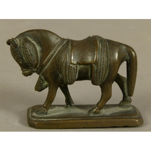 51 - A BRONZE FIGURE OF A TOAD, 4cm long together with a bronze horse with saddle and panniers, on rectan... 