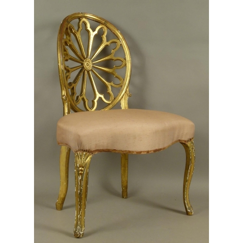 511 - A GEORGE III GILTWOOD SINGLE CHAIR in Robert Adam style, the concave oval back finely pierced and ca... 