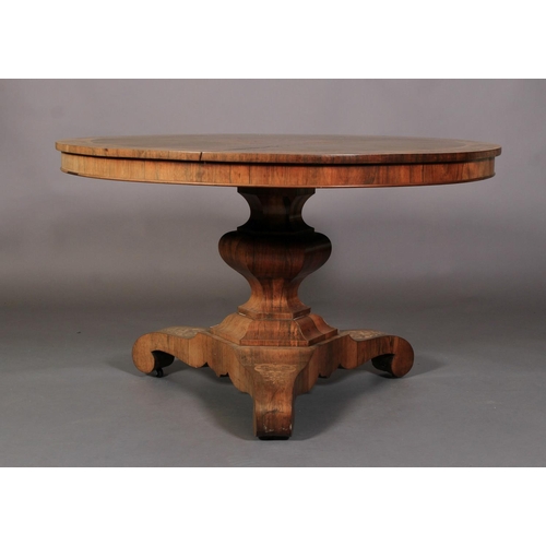 515 - AN EARLY VICTORIAN ROSEWOOD VENEERED CIRCULAR BREAKFAST TABLE, the segmented top with foliate arched... 