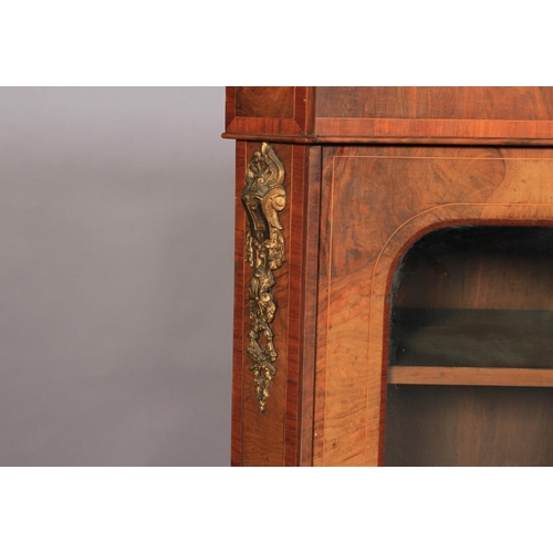 516 - A MID VICTORIAN GILT METAL MOUNTED WALNUT BREAKFRONT SIDE CABINET with central mirrored door flanked... 