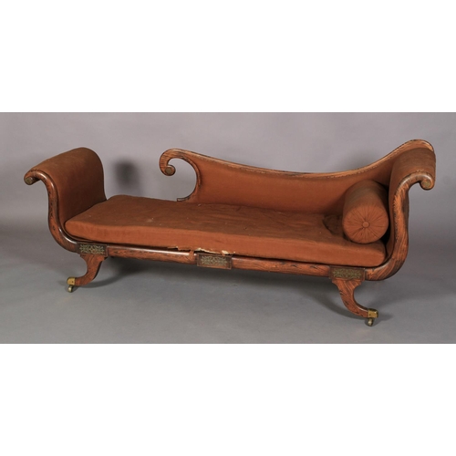 521 - A REGENCY FAUX ROSEWOOD DECORATED DAY BED, the back, scrolling arm and seat upholstered in brown rep... 