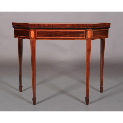 522 - A GEORGE III INLAID MAHOGANY CARD TABLE, the chamfered oblong top with figured panel within broad sa... 