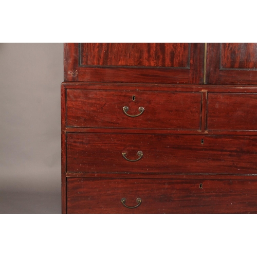 525 - A GEORGE III MAHOGANY CLOTHES PRESS with dental moulded cornice, above a pair of doors, four interio... 