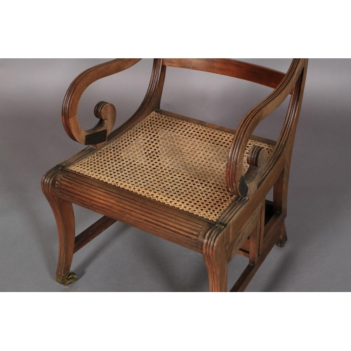 528 - A REGENCY MAHOGANY PATENT METAMORPHIC LIBRARY CHAIR in the manner of Morgan & Saunders, having a mou... 