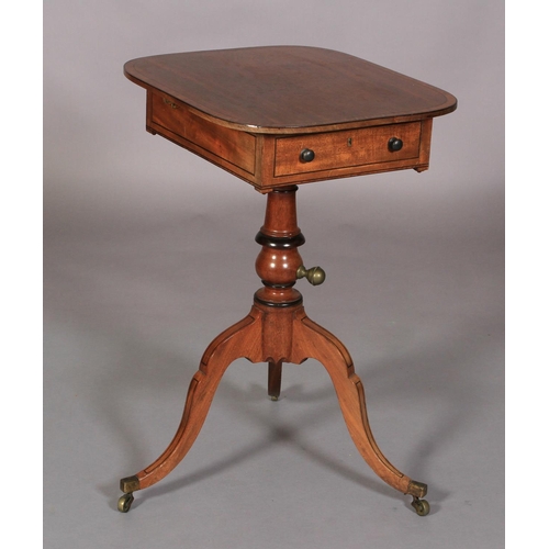 529 - A REGENCY MAHOGANY READING TABLE line inlaid throughout with ebony stringing, the rounded oblong top... 