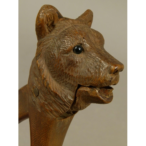 53 - A BLACK FOREST BEAR NUT CRACK with black glass eyes, 16cm high late 19th/early 20th century together... 