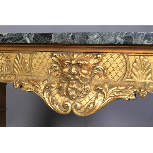 534 - AN OLD REPRODUCTION GILTWOOD SIDE TABLE in the style of William Kent, the verde amtico marble top ab... 