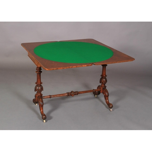 535 - A VICTORIAN BURR WALNUT VENEERED CARD TABLE of rounded rectangular form, the folding top quarter ven... 