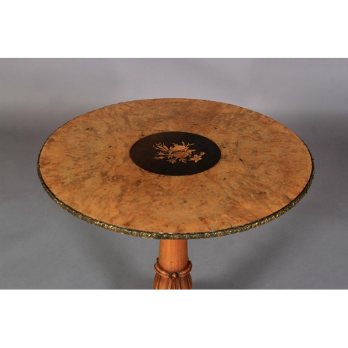 536 - AN EARLY VICTORIAN WALNUT TABLE, the circular segmental veneered top with applied gilt and floral ma... 