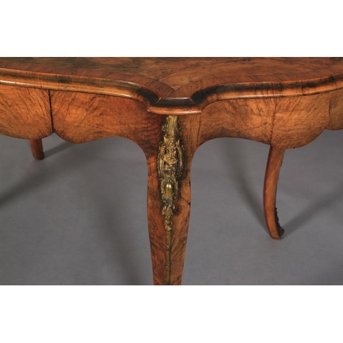 537 - A VICTORIAN FIGURED WALNUT OVAL CENTRE TABLE, quarter-veneered and inlaid in coloured and stained fl... 