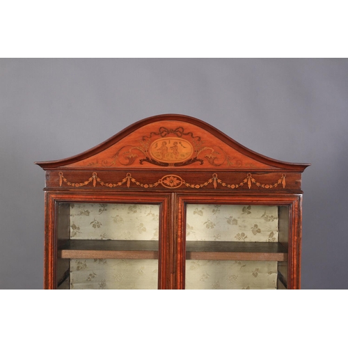 538 - A LATE VICTORIAN SHERATON REVIVAL SATINWOOD BOOKCASE ON STAND, the arched top with applied cavetto m... 