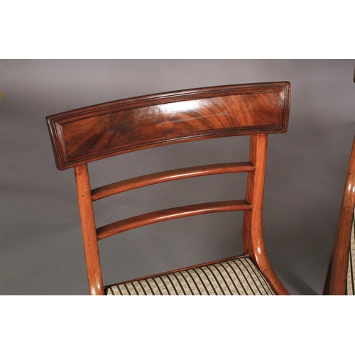 543 - A SET OF FOUR REGENCY MAHOGANY SABRE LEG DINING CHAIRS with figured concave cresting rails and mould... 