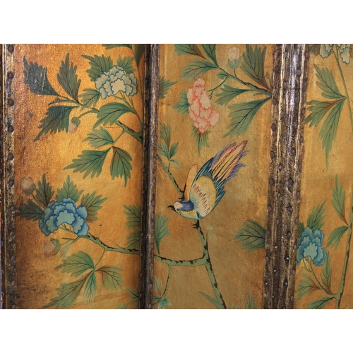 550 - A LEATHER FOUR FOLD SCREEN, each panel painted with birds and flowering branches, shaded gilt ground... 