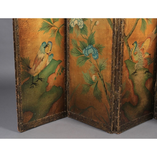 550 - A LEATHER FOUR FOLD SCREEN, each panel painted with birds and flowering branches, shaded gilt ground... 