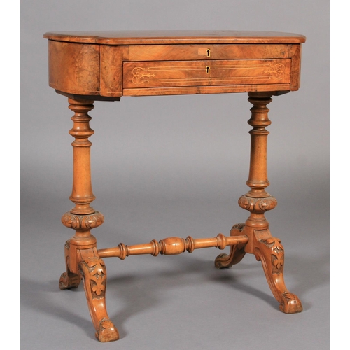 551 - A VICTORIAN WALNUT VENEERED WORK TABLE, of rounded rectangular form, the hinged lid revealing green ... 